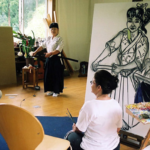 Vivian painting a woman with sword