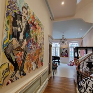 Hallway with painting and stair railing