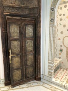 Wooden door in tiled room