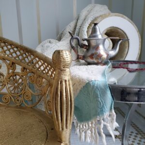 Tea pot on towel and table