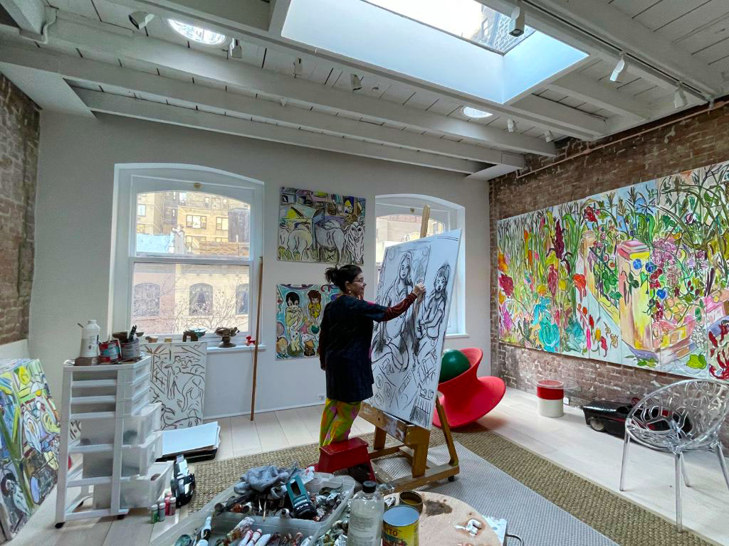 Vivian painting in her studio