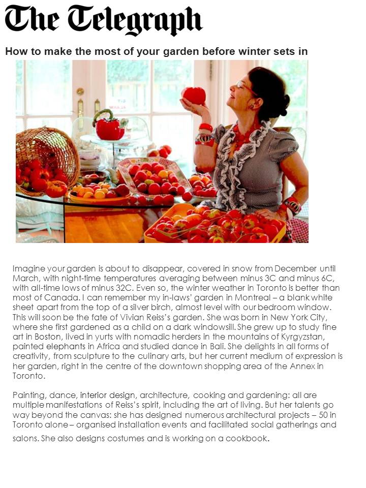 Vivian holding large red tomatoes