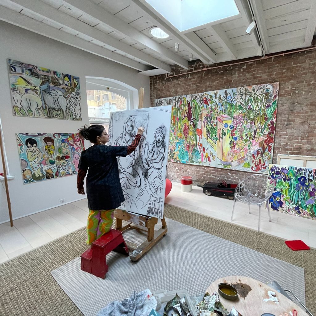 Vivian painting in studio