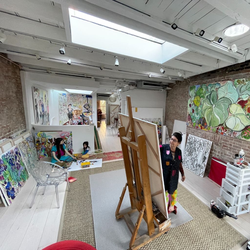 Vivian painting in studio