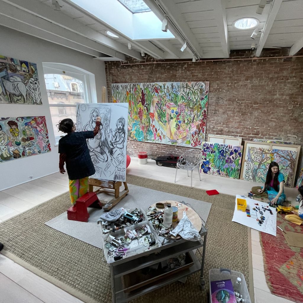 Vivian painting in studio